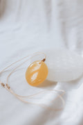 Orange Calcite Crystal Pendant on adjustable cord | Joy • Creativity • Motivation